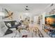 Open-concept living room with modern decor and seamless flow between spaces at 3399 Mermoor Dr # 301, Palm Harbor, FL 34685