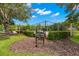 Community park features tennis courts, manicured lawns, and mature trees at 3399 Mermoor Dr # 301, Palm Harbor, FL 34685