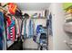 A walk-in closet with shelving, clothes hanging and shoe storage in an organized fashion at 3399 Mermoor Dr # 301, Palm Harbor, FL 34685
