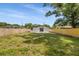 Large backyard featuring a well-maintained lawn and privacy fence at 3910 W Iowa Ave, Tampa, FL 33616