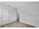 Bright bedroom boasts neutral paint, wood-look tile flooring, and a closet at 3910 W Iowa Ave, Tampa, FL 33616