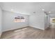 Bright bedroom featuring hardwood floors and natural light at 3910 W Iowa Ave, Tampa, FL 33616