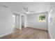 Light-filled bedroom with wood-look tile flooring, a ceiling fan, and neutral paint at 3910 W Iowa Ave, Tampa, FL 33616