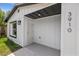 Exterior front entrance with a modern design, and visible house number at 3910 W Iowa Ave, Tampa, FL 33616