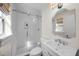 Modern bathroom with a glass-enclosed shower, white tile, and a sleek vanity at 4103 W Bay Villa Ave, Tampa, FL 33611
