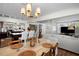 Inviting dining area flows into the living room and features modern lighting at 4103 W Bay Villa Ave, Tampa, FL 33611