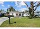 Charming single-story home features a well-manicured lawn and beautiful curb appeal at 4103 W Bay Villa Ave, Tampa, FL 33611