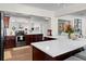 Bright, open kitchen with stainless steel appliances, custom cabinets, and a large center island for entertaining at 4103 W Bay Villa Ave, Tampa, FL 33611