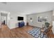 Inviting living room with wood-look floors, natural light, and comfortable seating at 4103 W Bay Villa Ave, Tampa, FL 33611