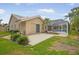 Spacious home with a screened-in pool with patio and lush green yard at 4138 Saltwater Blvd, Tampa, FL 33615