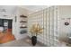 Stylish bathroom with a glass-block shower and floating shelves for storage at 4138 Saltwater Blvd, Tampa, FL 33615