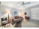Cozy bedroom with a floral chair, and neutral decor that creates a calming atmosphere at 4138 Saltwater Blvd, Tampa, FL 33615