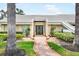 Charming front entrance with lush landscaping and a striking double door entrance at 4138 Saltwater Blvd, Tampa, FL 33615
