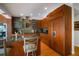Gourmet kitchen features custom wood cabinetry, granite counters, and stainless steel appliances at 4138 Saltwater Blvd, Tampa, FL 33615