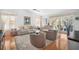 Bright living room features hardwood floors, elegant furniture, and a view of the backyard at 4138 Saltwater Blvd, Tampa, FL 33615
