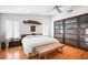 The primary bedroom has hardwood floors, a ceiling fan, and lots of storage space at 4138 Saltwater Blvd, Tampa, FL 33615