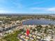 Gorgeous aerial view shows the home's proximity to the bay, lake, golf course, and other community amenities at 456 Bayou Village Dr, Tarpon Springs, FL 34689