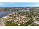 Beautiful aerial view of the home's community showing nearby parks and waterways; the home is indicated by a red arrow at 456 Bayou Village Dr, Tarpon Springs, FL 34689