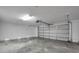 Spacious garage with ample storage space and smooth concrete flooring at 456 Bayou Village Dr, Tarpon Springs, FL 34689