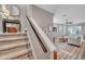 Stairway showing the open-concept living area with modern décor and comfortable seating at 456 Bayou Village Dr, Tarpon Springs, FL 34689