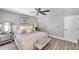 Inviting main bedroom featuring plush bedding, stylish decor, and an abundance of natural light at 456 Bayou Village Dr, Tarpon Springs, FL 34689