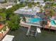 Aerial view of waterfront home showing the screened in pool and boat dock at 4643 Bay Crest Dr, Tampa, FL 33615