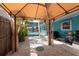 Backyard featuring shell landscaping, a tent and glimpses of a pool at 4643 Bay Crest Dr, Tampa, FL 33615