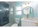 Modern bathroom featuring tiled shower, white vanity, and stylish round mirror at 4643 Bay Crest Dr, Tampa, FL 33615