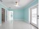 Bedroom with ceiling fan, walk-in closet, and a door to the back patio area at 4643 Bay Crest Dr, Tampa, FL 33615