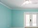 Bedroom featuring white trim, a ceiling fan, and double doors to the backyard at 4643 Bay Crest Dr, Tampa, FL 33615