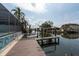 Beautiful view of the canal from the property's wood dock with boat lift at 4643 Bay Crest Dr, Tampa, FL 33615