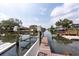 Exterior shot of the boat lift on the canal from the wood dock at 4643 Bay Crest Dr, Tampa, FL 33615