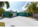 Charming single-story home featuring a two-car garage, large driveway, and lush landscaping at 4643 Bay Crest Dr, Tampa, FL 33615