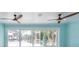 Living room area with fans, access to the back yard, and great natural lighting at 4643 Bay Crest Dr, Tampa, FL 33615