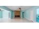 Spacious living room with tile flooring, modern fireplace, and plenty of natural light at 4643 Bay Crest Dr, Tampa, FL 33615