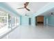Open-concept living space with backyard access, modern lighting, and beautiful fireplace at 4643 Bay Crest Dr, Tampa, FL 33615