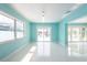 Bright living room with canal view through sliding doors and large windows at 4643 Bay Crest Dr, Tampa, FL 33615