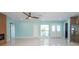 Open-concept living space with recessed lighting, tile flooring, and a modern fireplace at 4643 Bay Crest Dr, Tampa, FL 33615