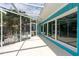 The covered patio offers a nice area for entertaining, with clear views through the screen to the backyard at 4643 Bay Crest Dr, Tampa, FL 33615