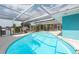 This home has a beautiful screened-in pool with a view of the canal at 4643 Bay Crest Dr, Tampa, FL 33615