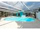 Relaxing screened-in pool area with sparkling blue water and ample space for lounging and entertaining by the pool at 4643 Bay Crest Dr, Tampa, FL 33615
