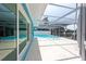 The screened-in pool offers clear water with backyard water view for a refreshing swim and serene relaxation at 4643 Bay Crest Dr, Tampa, FL 33615