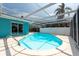 Inviting screened-in pool with clear blue water, ideal for swimming and cooling off on warm days, with nice lounge area at 4643 Bay Crest Dr, Tampa, FL 33615