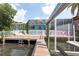 Exterior shot of the home with a screened in patio and canal front access at 4643 Bay Crest Dr, Tampa, FL 33615