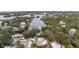 Waterfront homes surrounded by lush greenery and waterways in a quiet residential community at 608 Betmor Ln, Palm Harbor, FL 34683