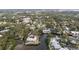 Waterfront property on a canal surrounded by lush greenery and mature trees in a desirable neighborhood at 608 Betmor Ln, Palm Harbor, FL 34683