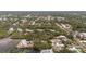A peaceful residential neighborhood is nestled amongst lush trees with waterfront properties along a tranquil river at 608 Betmor Ln, Palm Harbor, FL 34683
