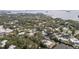 Picturesque neighborhood with waterfront properties nestled among lush greenery near the open water at 608 Betmor Ln, Palm Harbor, FL 34683