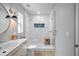 Modern bathroom featuring a glass shower, contemporary vanity, and stylish finishes at 608 Betmor Ln, Palm Harbor, FL 34683