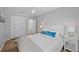 Bright bedroom with clean decor, ample closet space, and side tables at 608 Betmor Ln, Palm Harbor, FL 34683